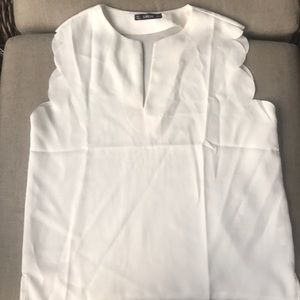 White blouse. Scalloped sleeve tank.